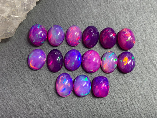 Ethiopian Opal oval 8x10mm cabochon - Natural Opal smoked to purple color