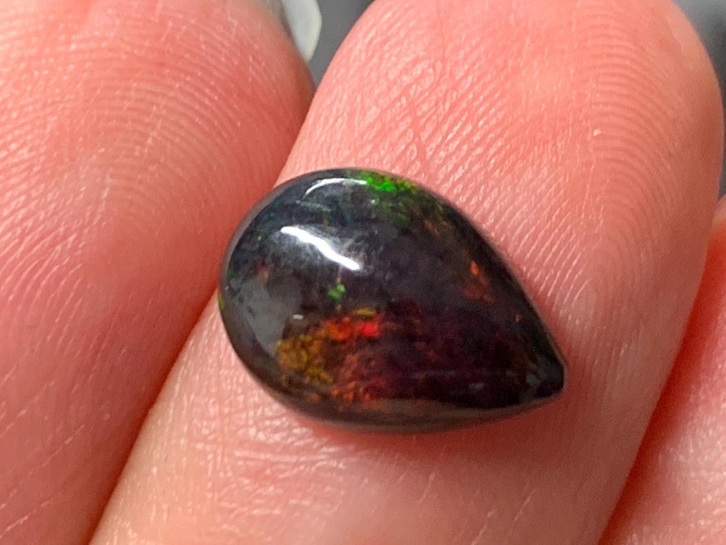 Natural Ethiopian Black Opal 8x11x4mm cabochon
