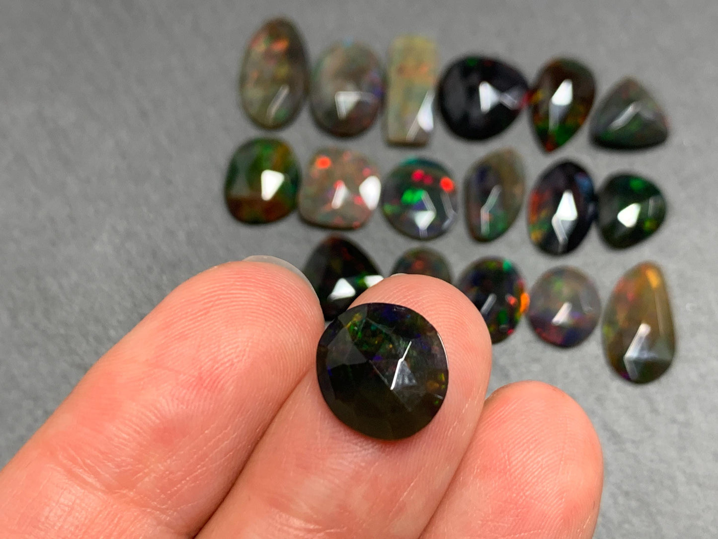 Faceted Black Ethiopian Opal 10-11mm long cabochon