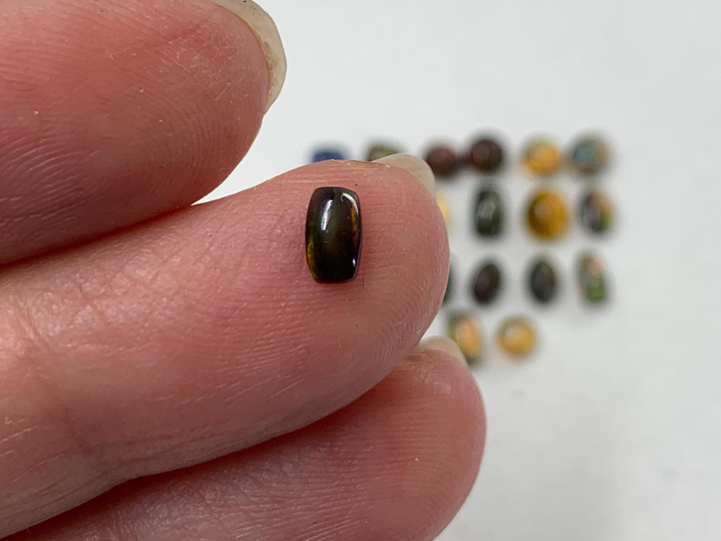 Natural Black Ethiopian Opal oval 4-5mm long cabochon *