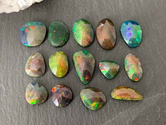Faceted black Ethiopian Opal 8-12mm long cabochon