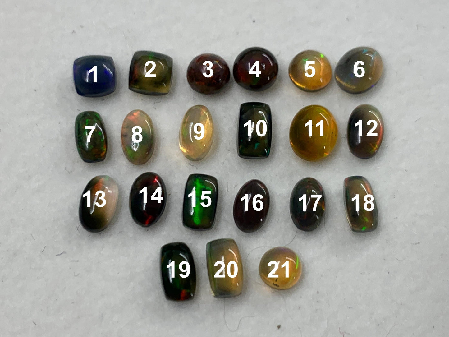 Natural Black Ethiopian Opal oval 4-5mm long cabochon *