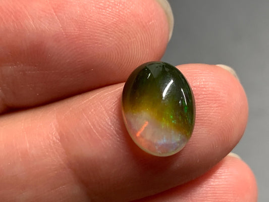 Natural Black Ethiopian Opal oval 9x11x4mm cabochon