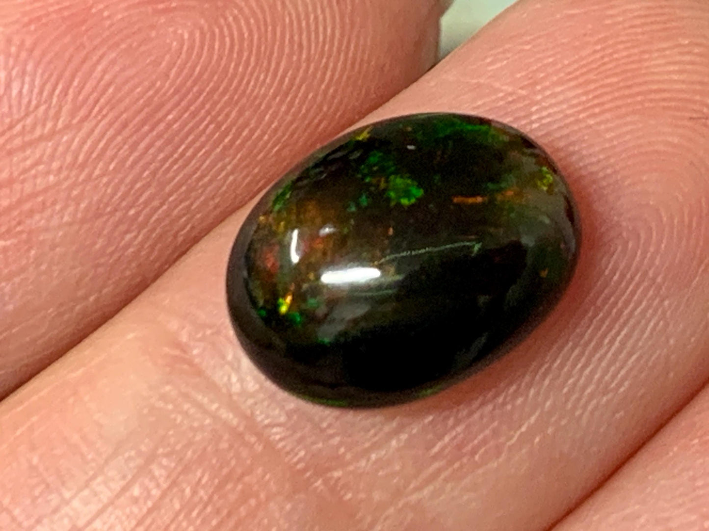 Natural Ethiopian Black Opal 9x12x5mm cabochon