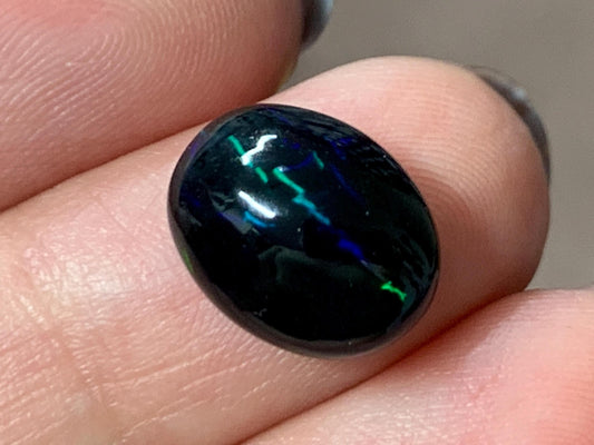 Natural Ethiopian Black Opal 10x12x5mm cabochon