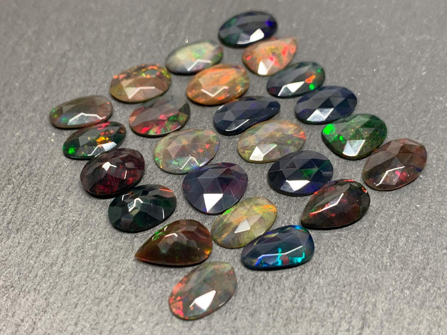 Faceted Black Ethiopian Opal 10-11mm long cabochon
