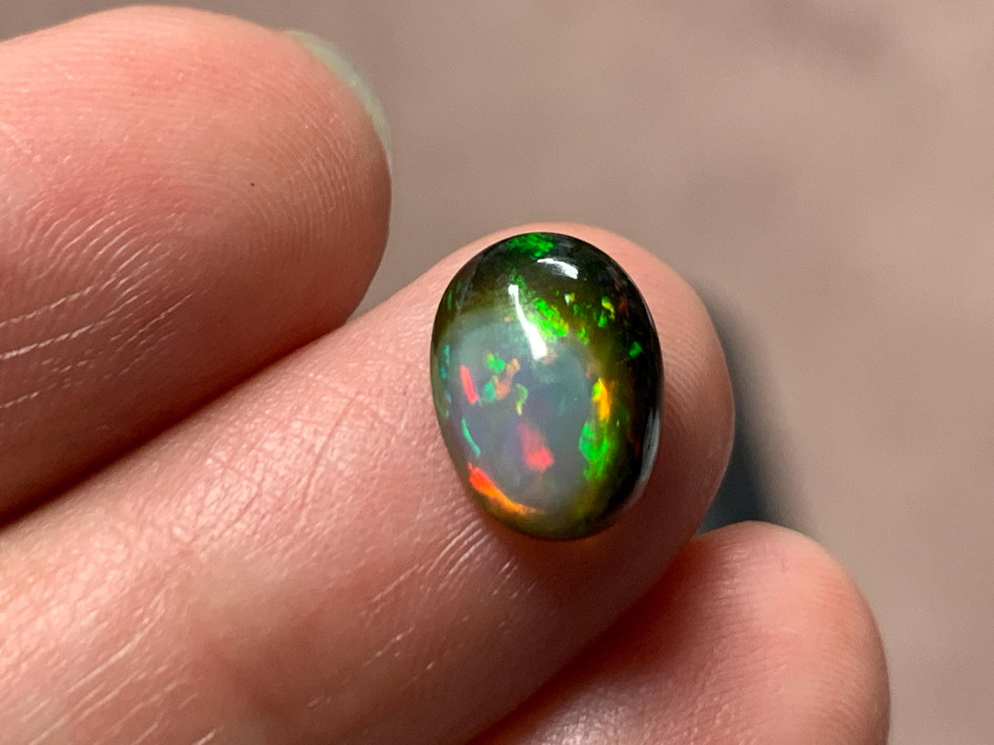 Natural Black Ethiopian Opal oval 8x11x4mm cabochon