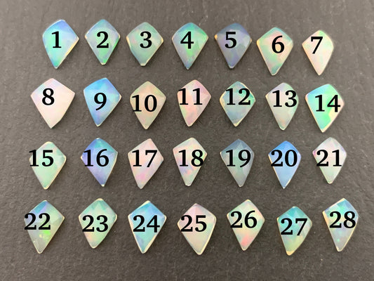 Faceted Ethiopian Opal kite 7-8mm long cabochon