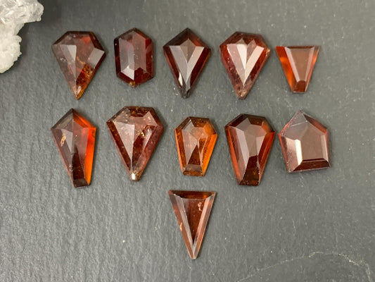 Faceted Hessonite Garnet 9-12mm long cabochon.