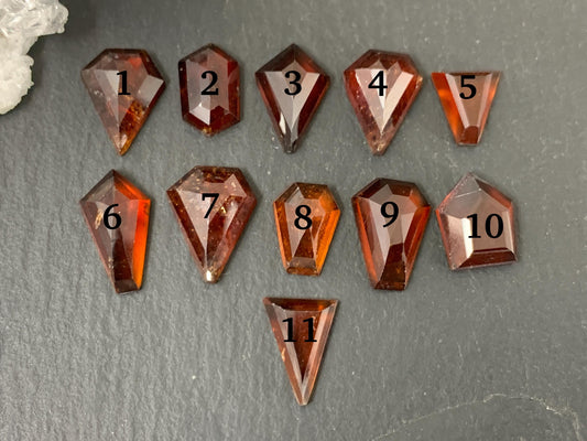 Faceted Hessonite Garnet 9-12mm long cabochon.