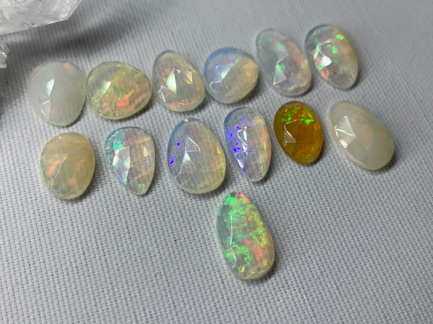 Faceted Ethiopian Opal 10-12mm long cabochon