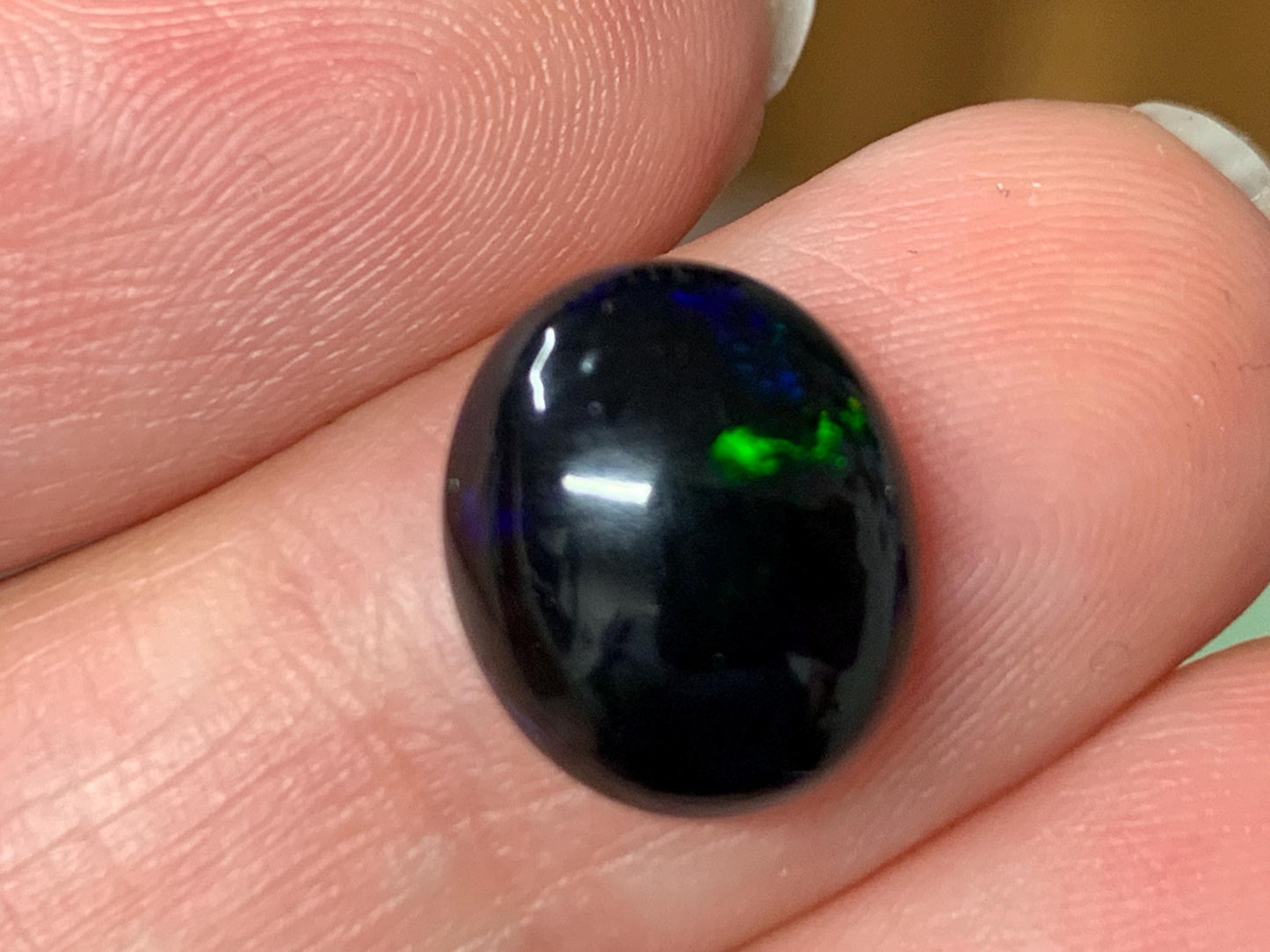 Natural Ethiopian Black Opal 10x12x5mm cabochon