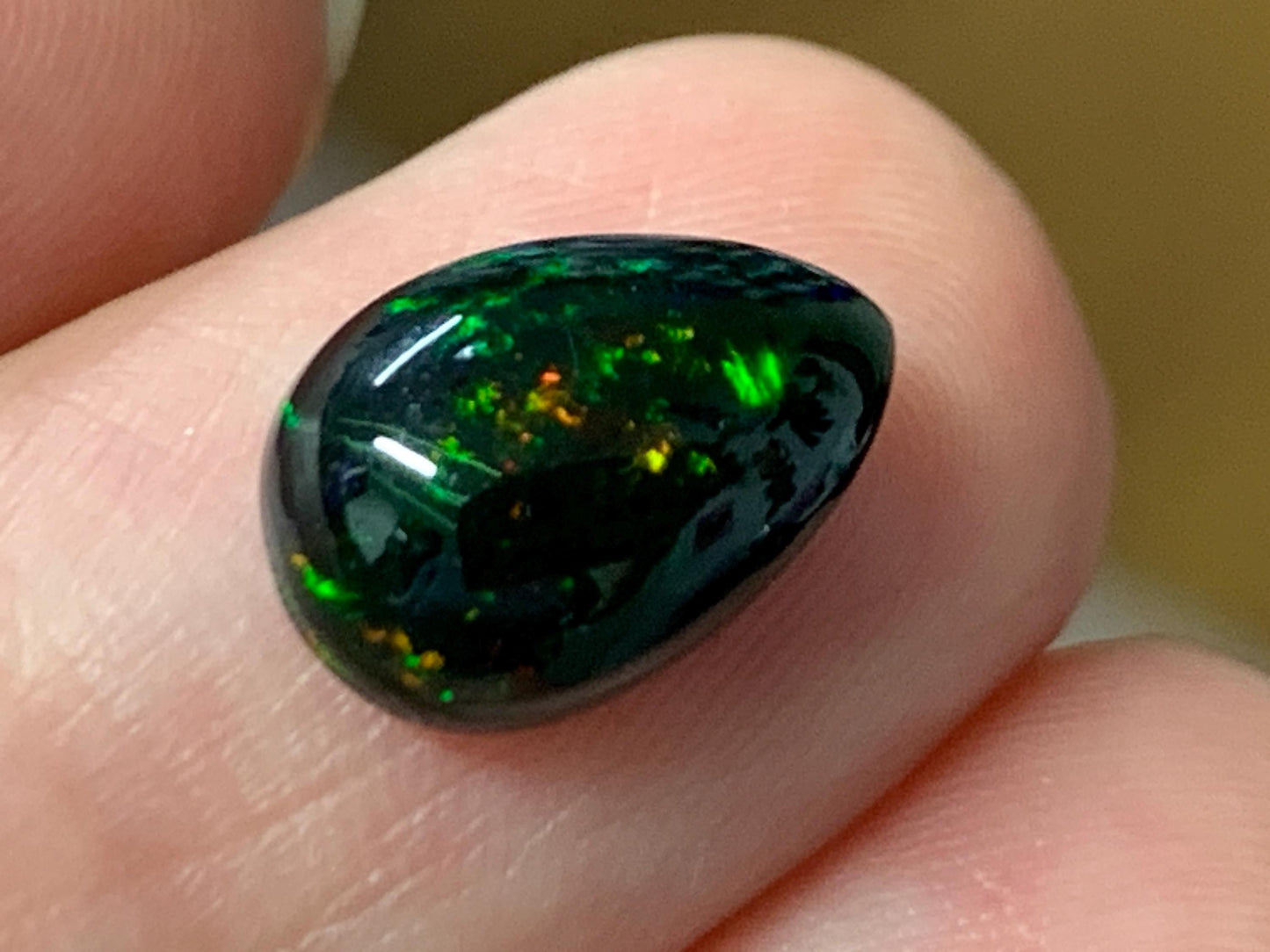Natural Ethiopian Black Opal 8x12x4mm cabochon