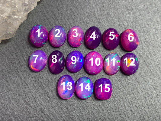 Ethiopian Opal oval 8x10mm cabochon - Natural Opal smoked to purple color