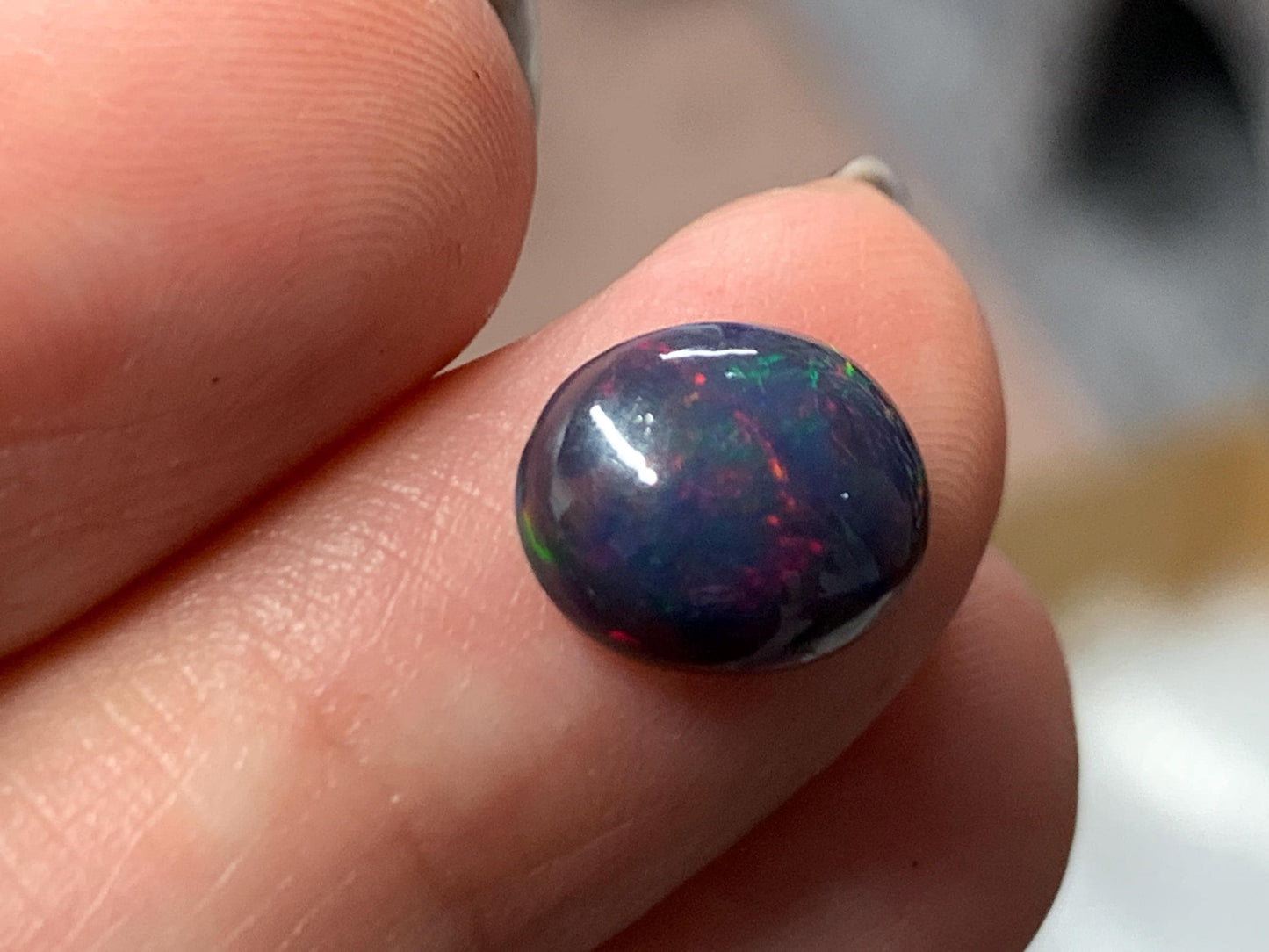 Natural Ethiopian Black Opal 8x11x4mm cabochon