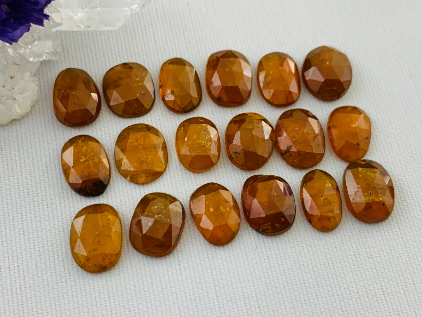 Faceted Orange Kyanite oval 9-10mm long cabochon