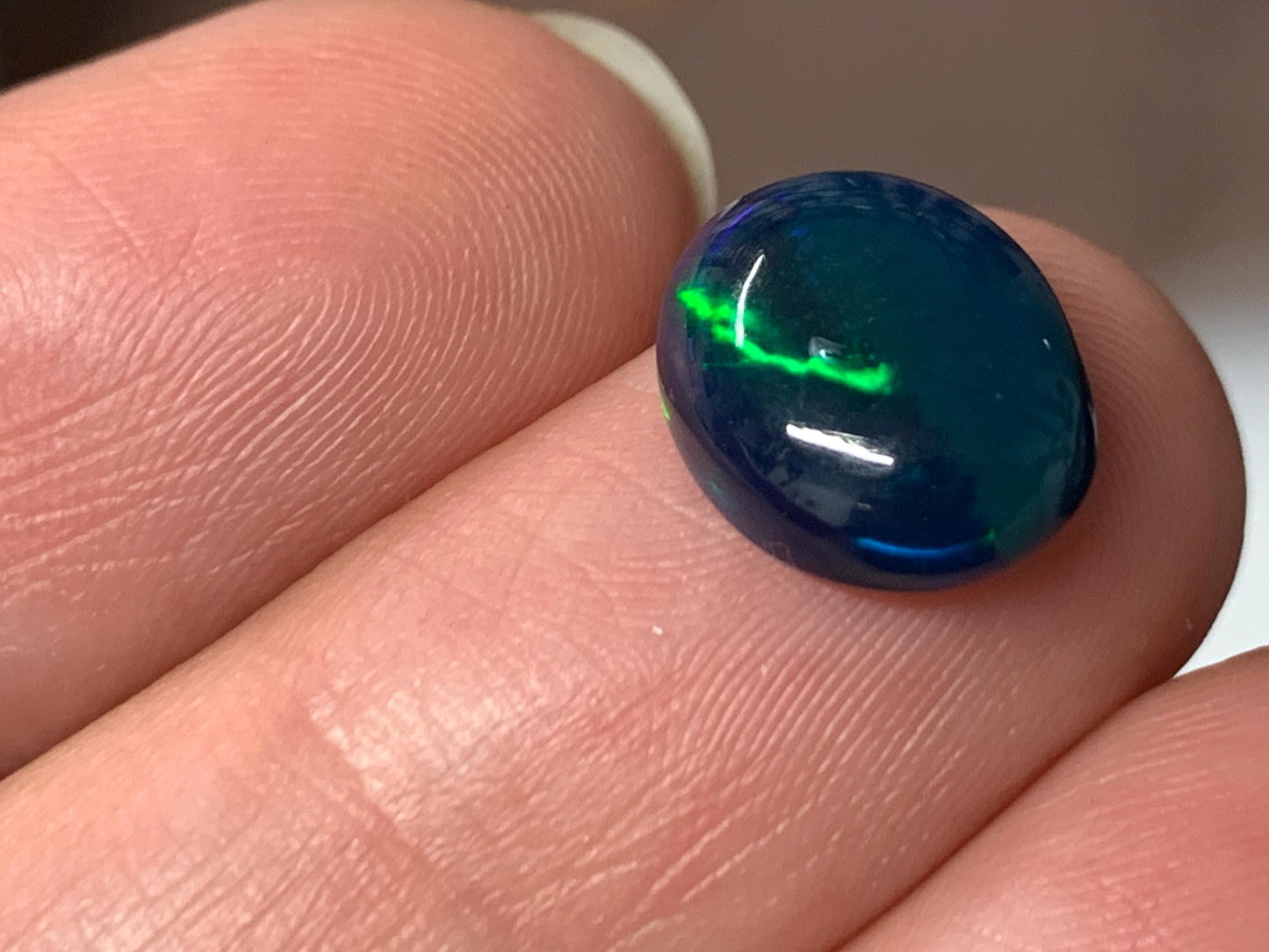 Natural Black Ethiopian Opal oval 9x11x4mm cabochon