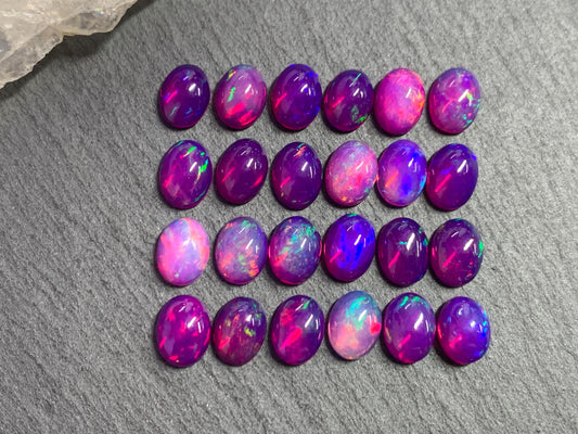 Ethiopian Opal oval 8x10mm cabochon - Natural Opal smoked to purple color