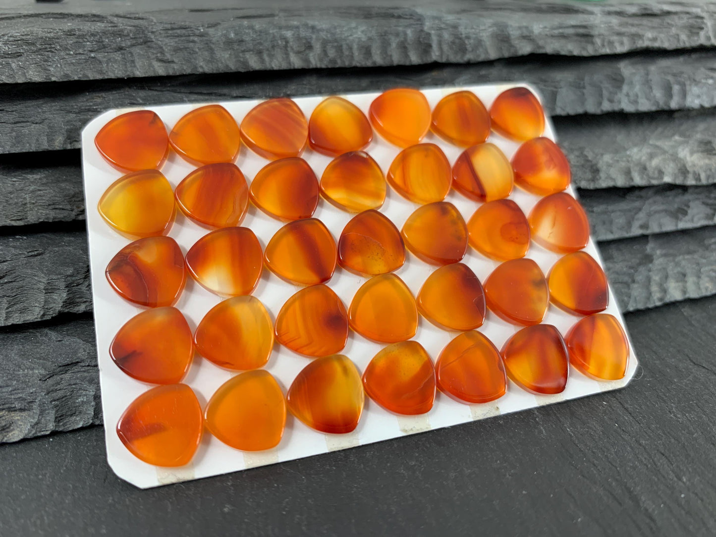 Flat Carnelian curved triangle 10mm cabochon - Calibrated cabochons