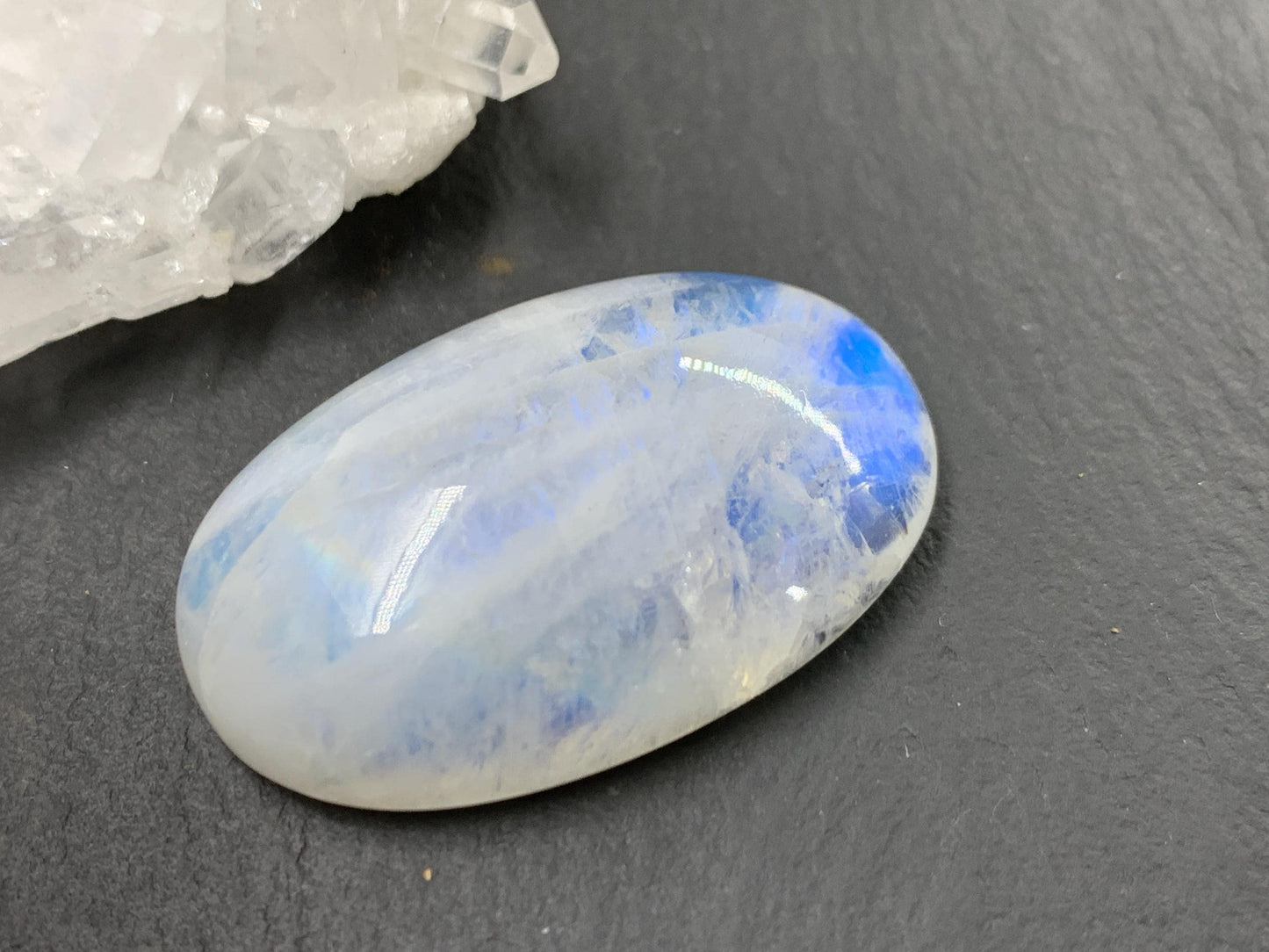 Rainbow Moonstone oval 33x21x9mm cabochon