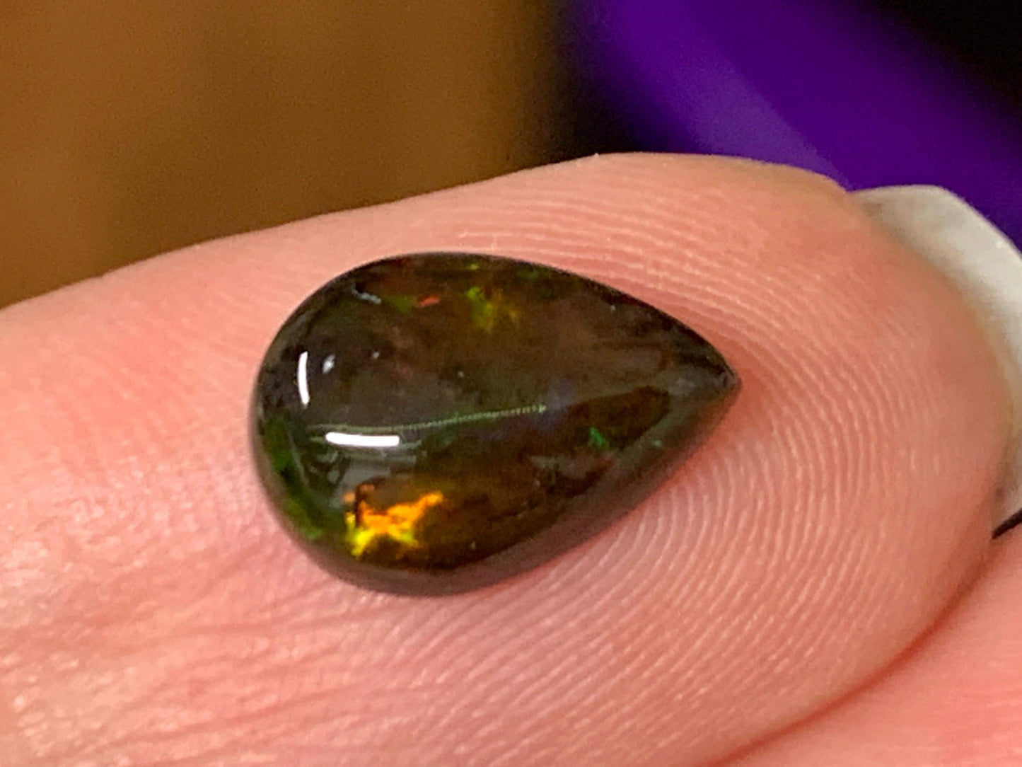 Natural Ethiopian Black Opal 7x11x3.5mm cabochon