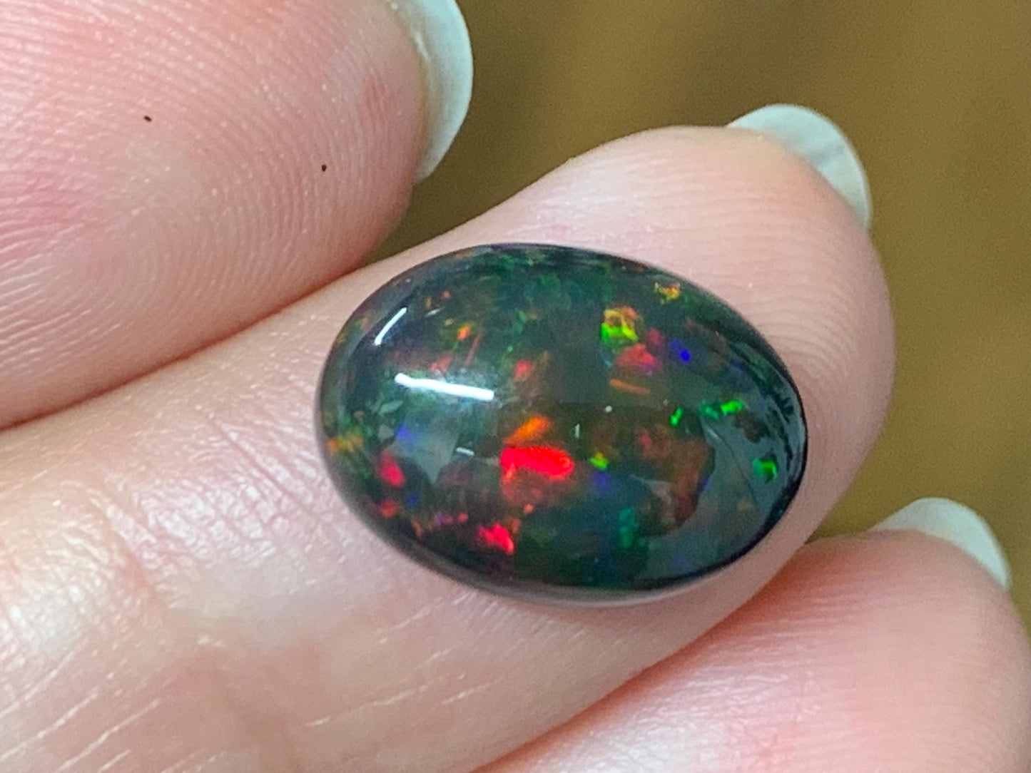 Natural Ethiopian Black Opal 10x13x5mm cabochon
