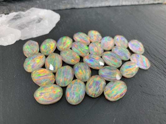 Faceted Aurora Opal oval 10x14mm cabochons  - Doublet cabochons