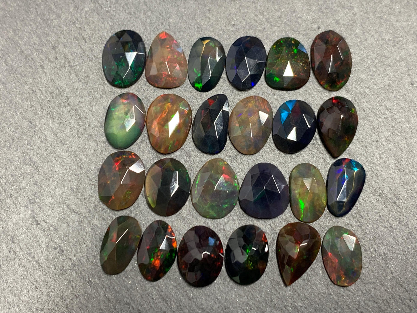 Faceted Black Ethiopian Opal 10-11mm long cabochon