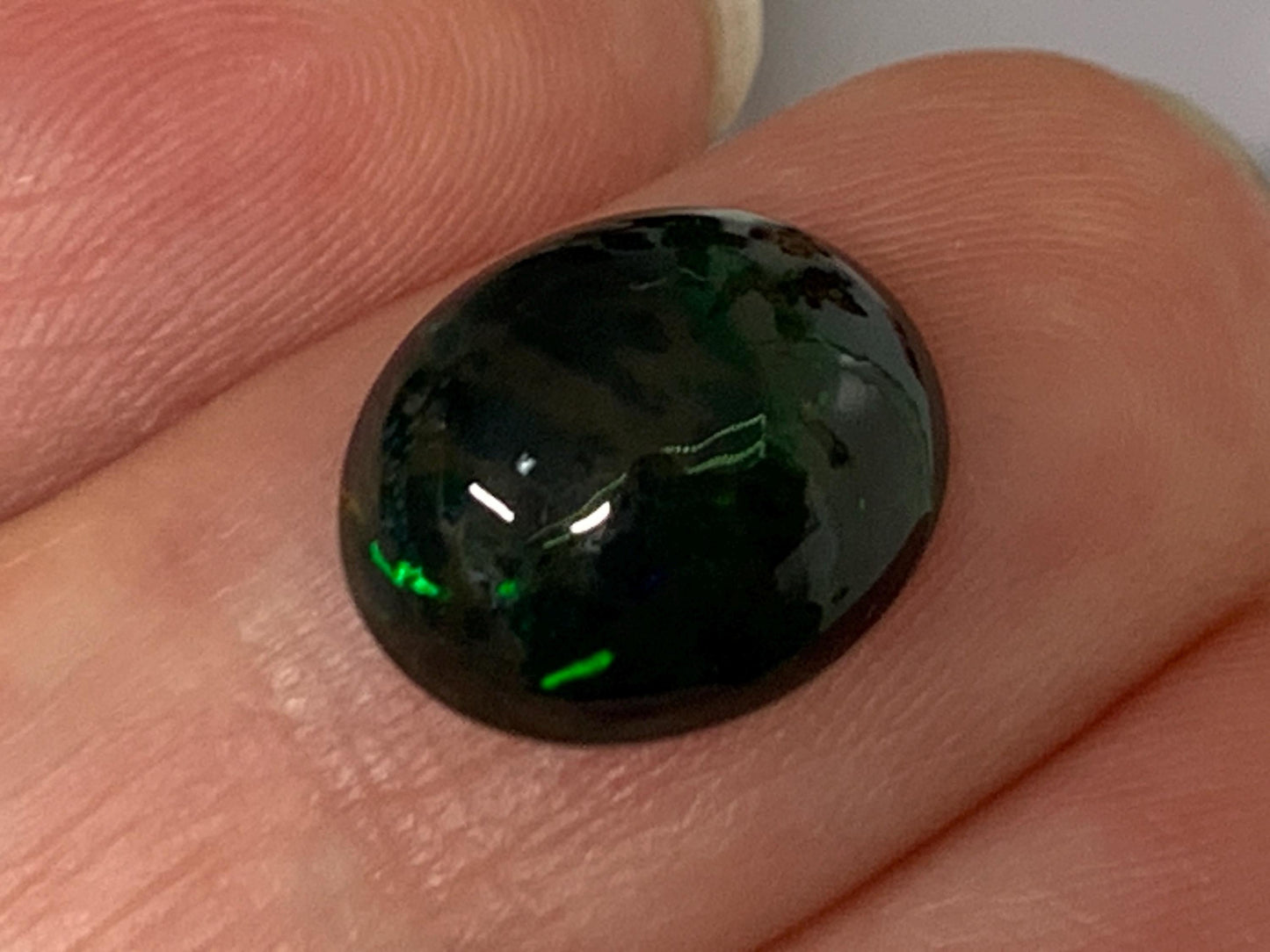 Natural Ethiopian Black Opal 10x12x4.5mm cabochon