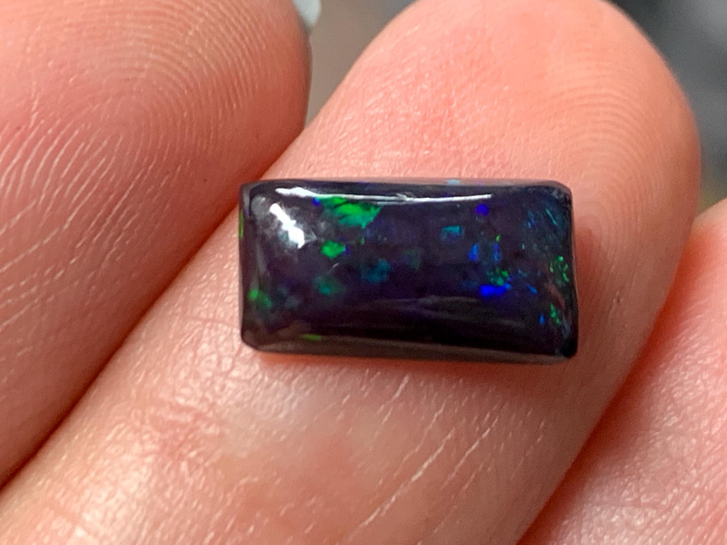 Natural Ethiopian Black Opal 6x11x3mm cabochon