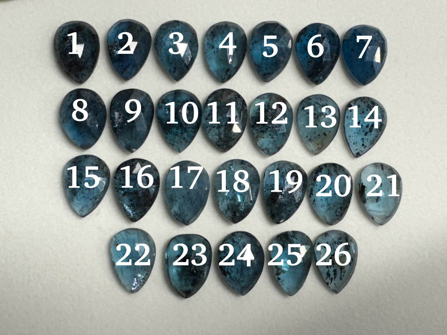 Faceted Moss Kyanite pear 10x14mm cabochon