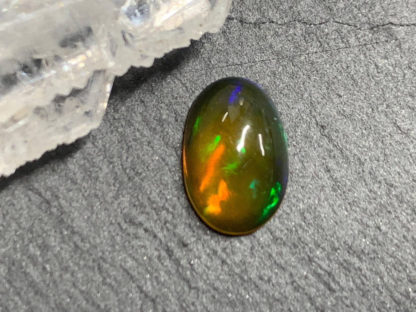 Natural Black Ethiopian Opal oval 6x10x4mm cabochon