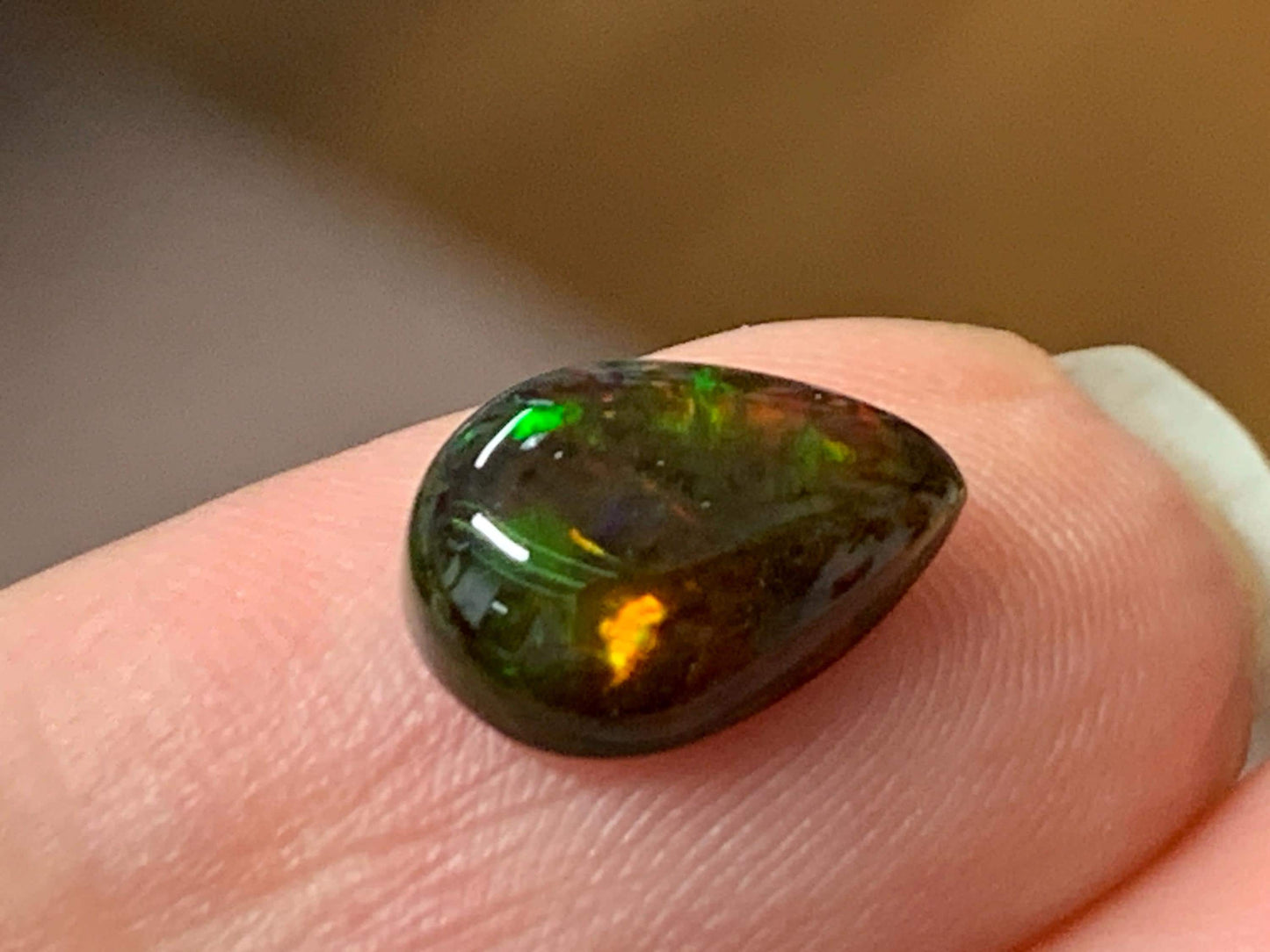 Natural Ethiopian Black Opal 7x11x3.5mm cabochon