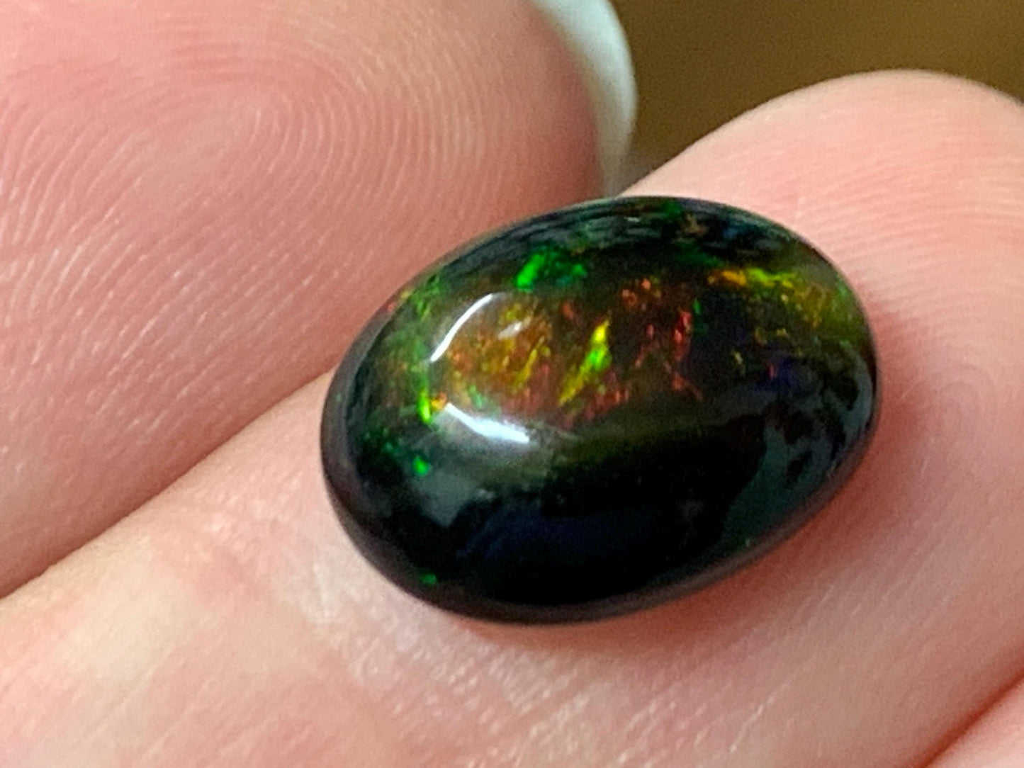 Natural Ethiopian Black Opal 9x12x5mm cabochon