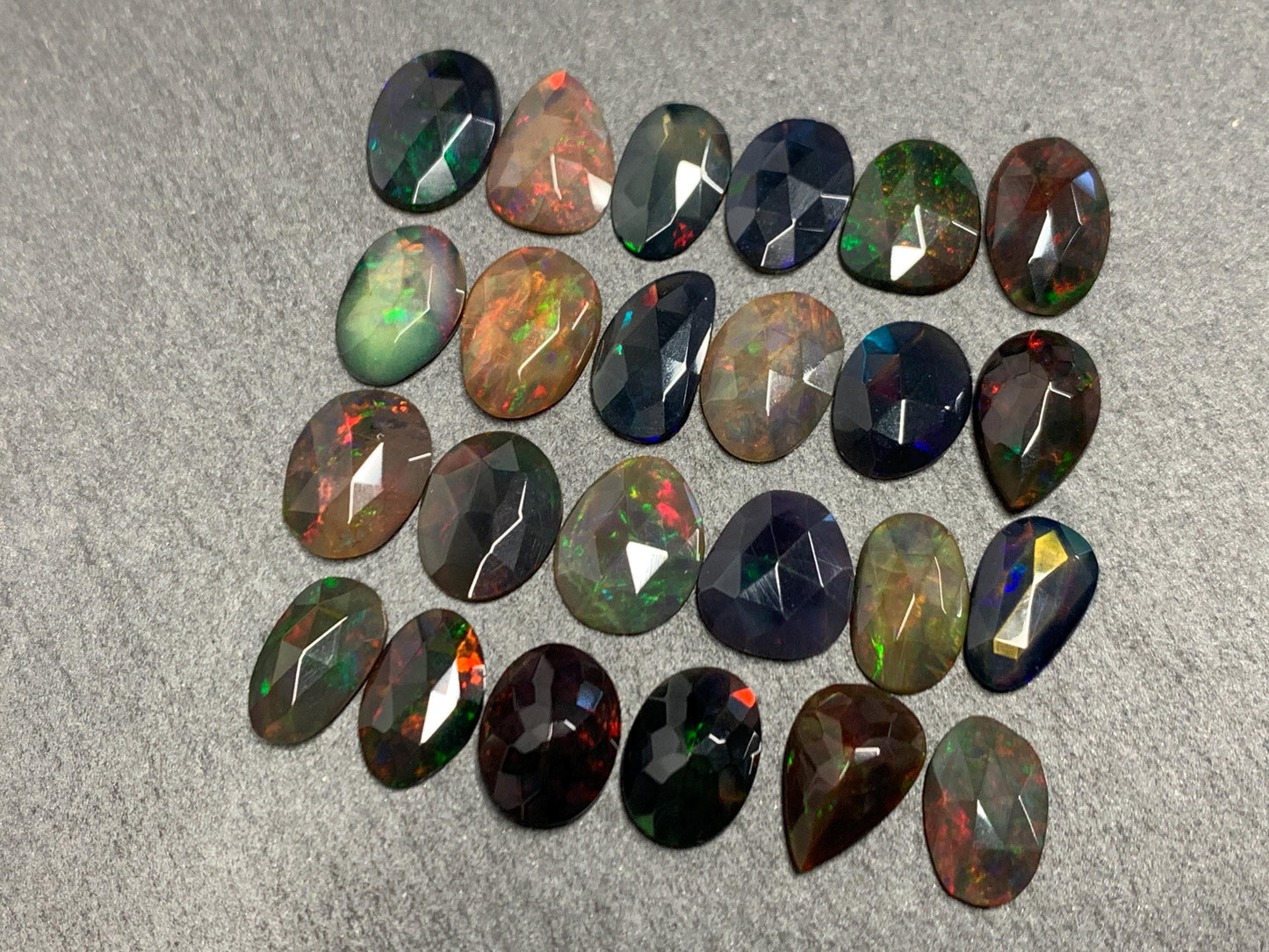 Faceted Black Ethiopian Opal 10-11mm long cabochon