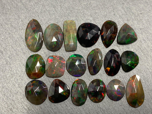 Faceted Black Opal oval 10-16mm long cabochon