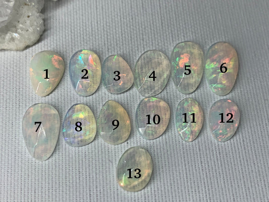 Faceted Ethiopian Opal 8-11mm cabochon