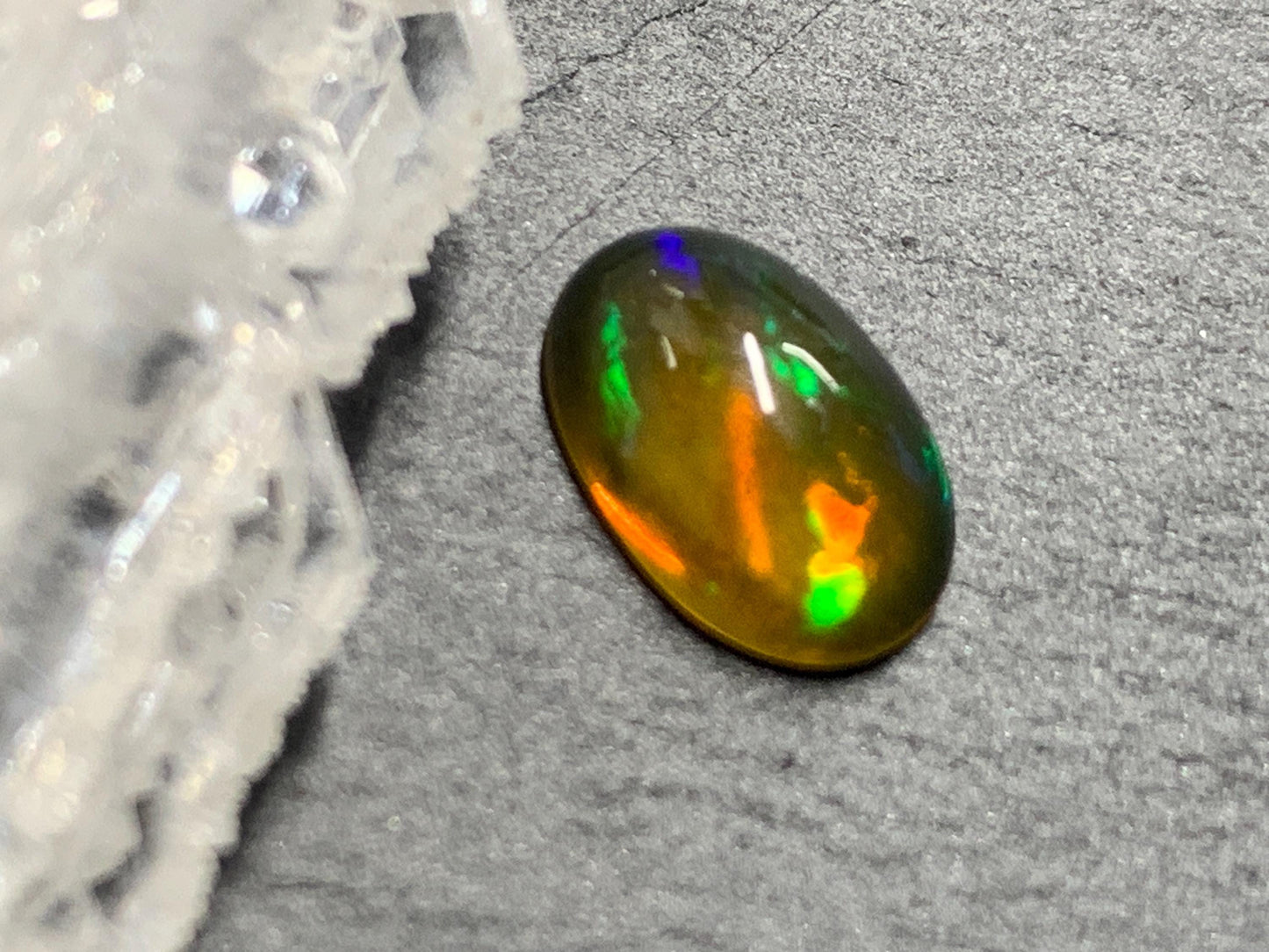 Natural Black Ethiopian Opal oval 6x10x4mm cabochon
