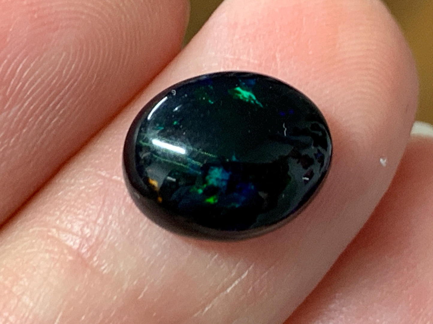 Natural Ethiopian Black Opal 9x11x4mm cabochon