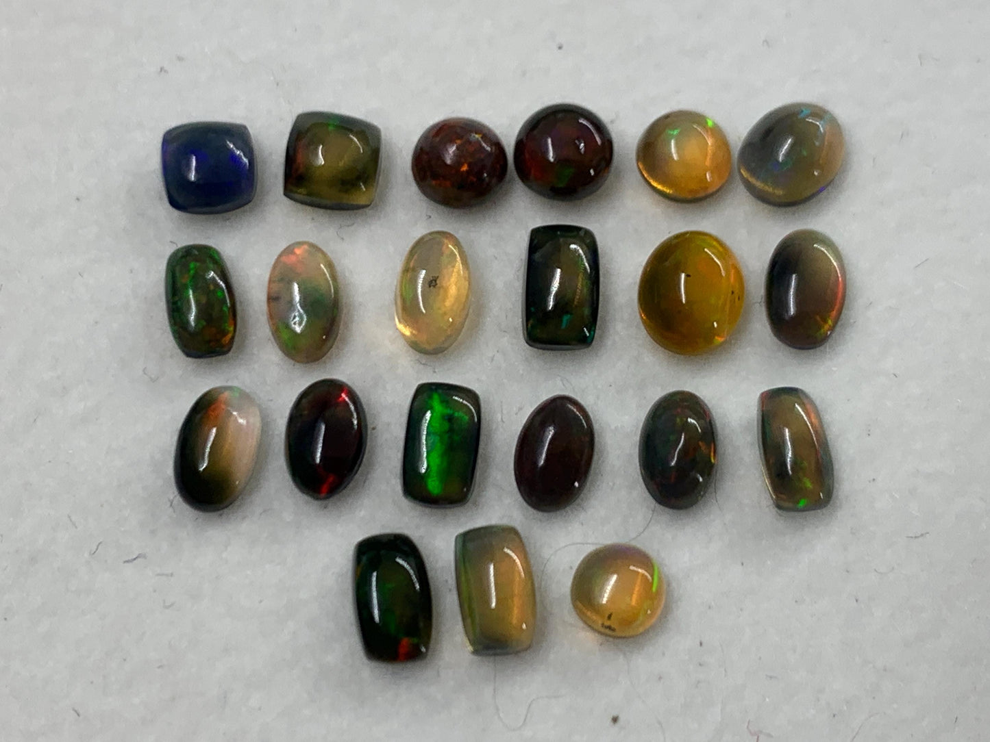 Natural Black Ethiopian Opal oval 4-5mm long cabochon *