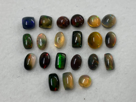 Natural Black Ethiopian Opal oval 4-5mm long cabochon *