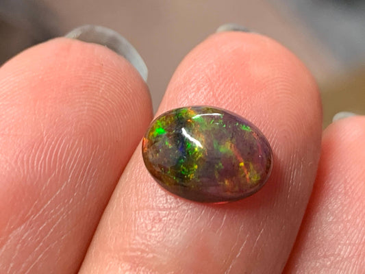 Natural Ethiopian Black Opal 7x10x3mm cabochon