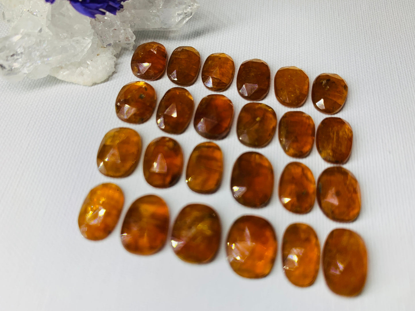 Faceted Orange Kyanite oval 10-11mm cabochon