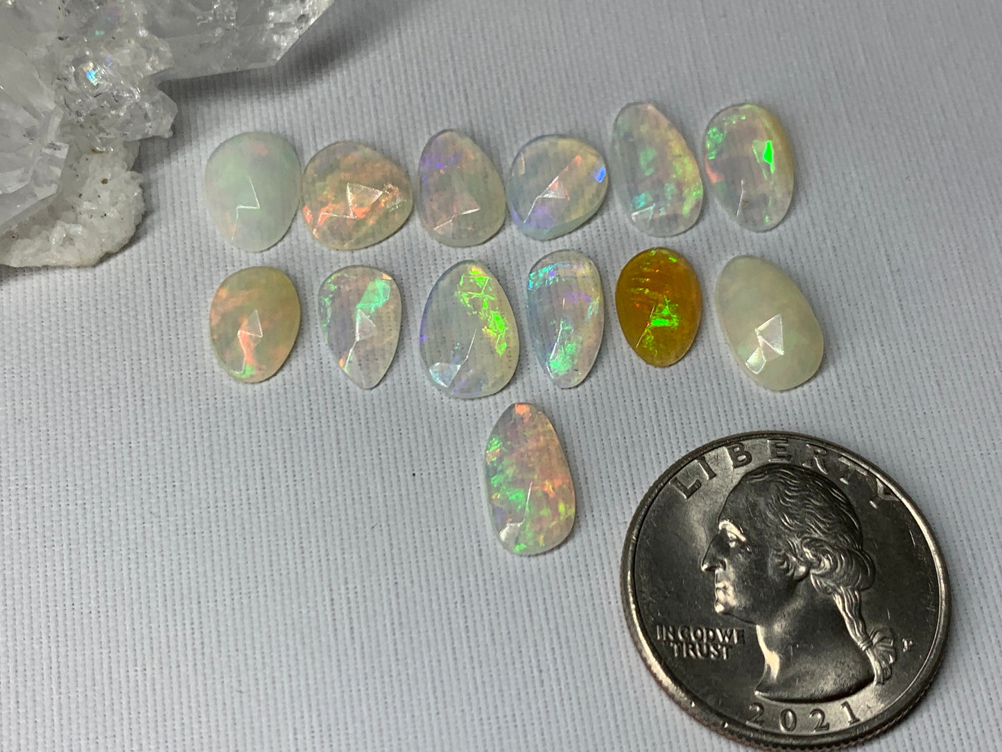 Faceted Ethiopian Opal 10-12mm long cabochon