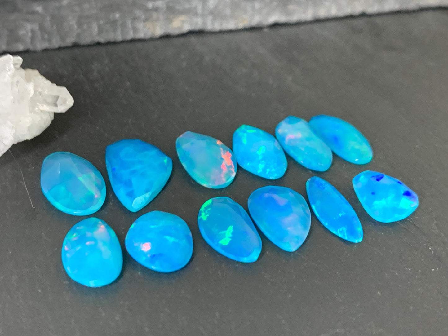 Faceted Blue Ethiopian Opal 11-16mm long cabochon
