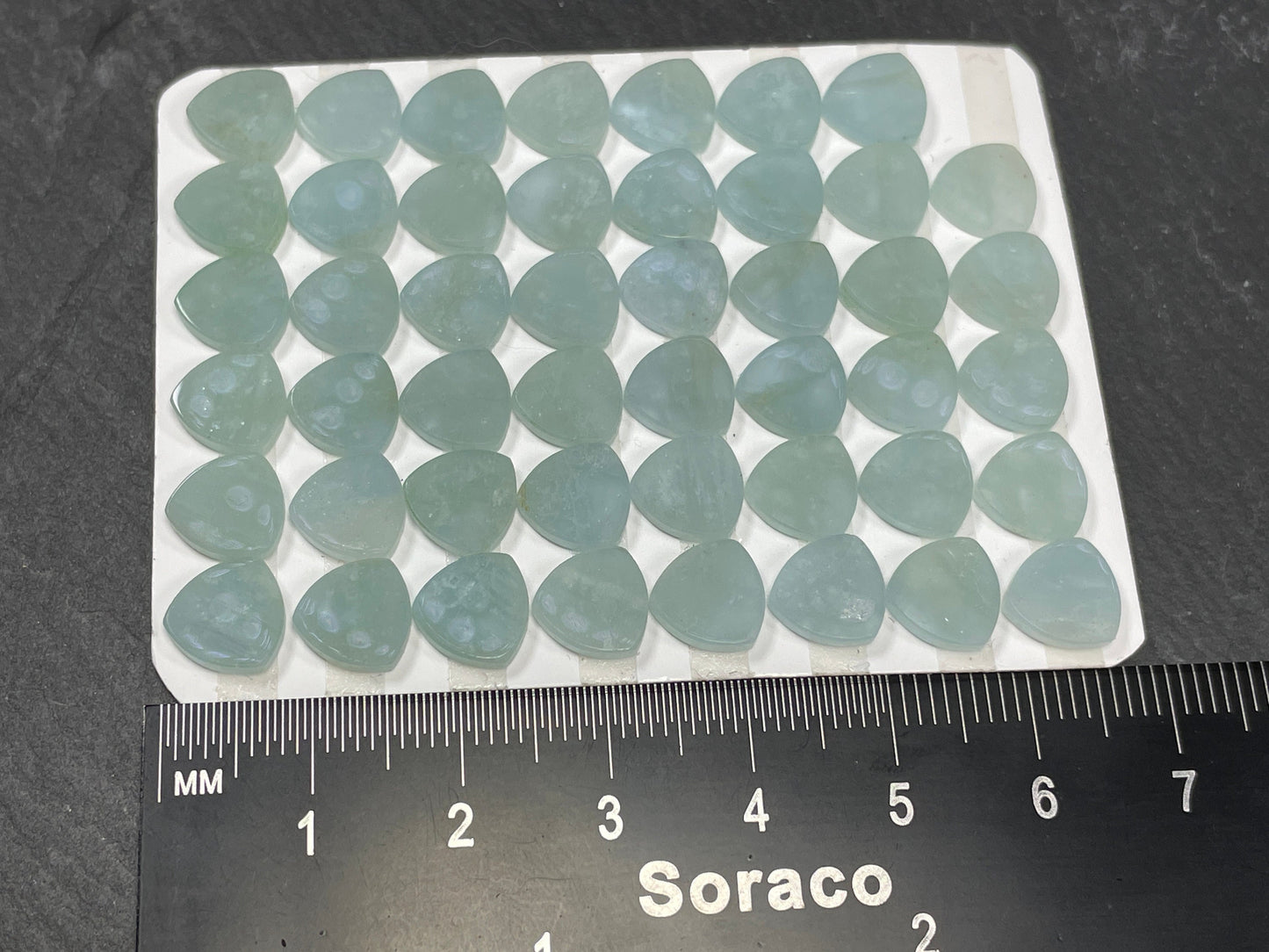 Flat Aquamarine curved triangle 8mm cabochon - Calibrated cabochons