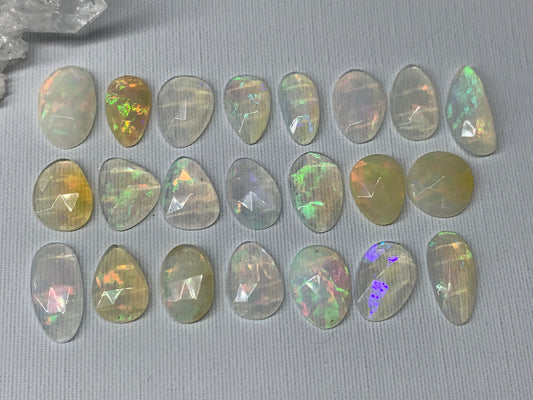 Faceted Ethiopian Opal 11-16mm long cabochon