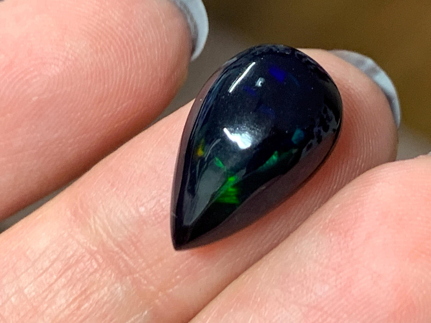 Natural Ethiopian Black Opal 10x16x5mm cabochon