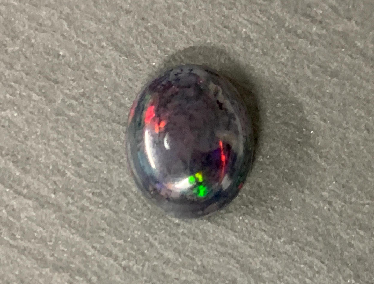 Natural Ethiopian Black Opal 9x11x5mm cabochon