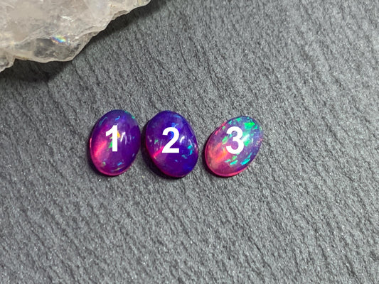 Ethiopian Opal oval 5x7mm cabochon - Natural Opal smoked to purple color